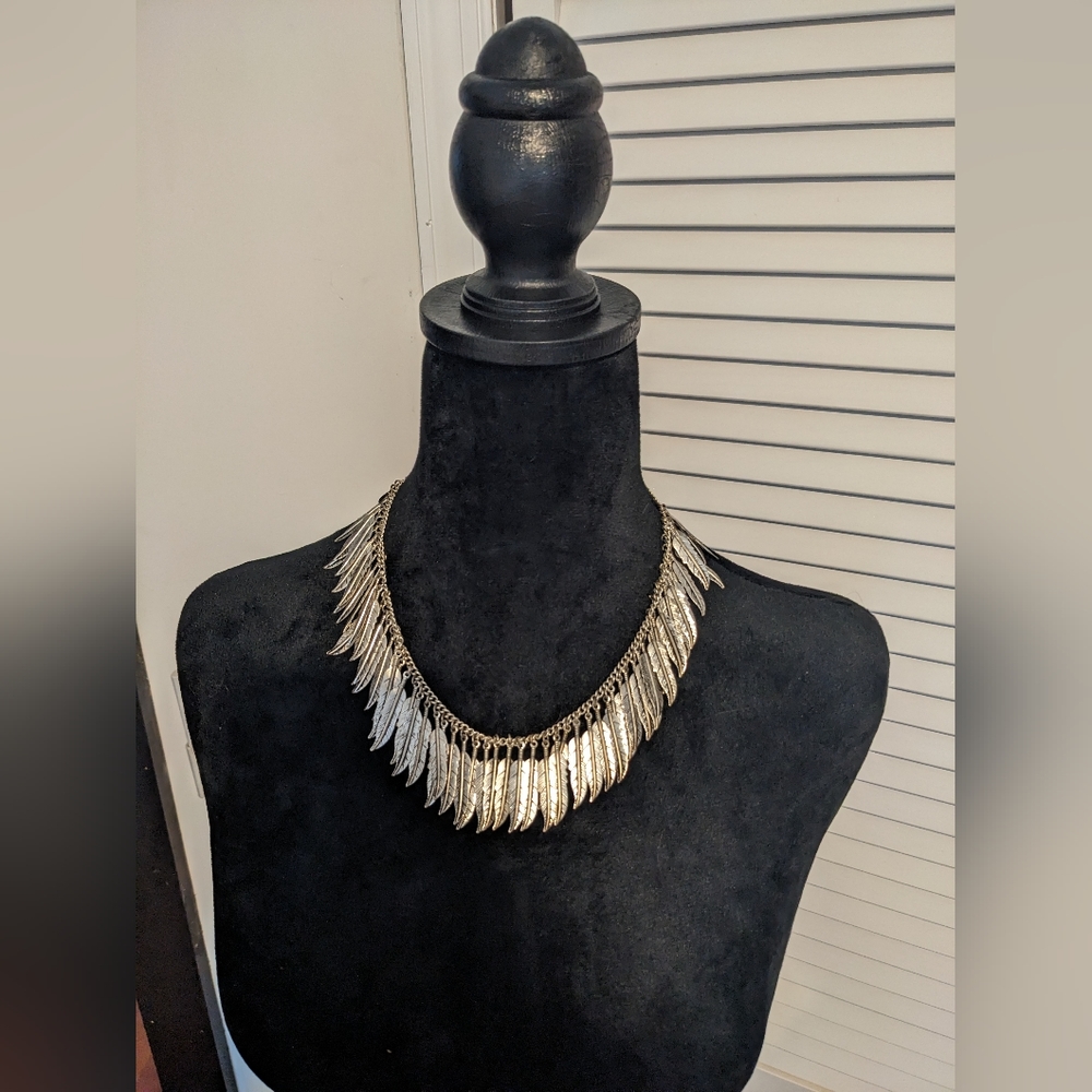 Silver feather necklace, represents freedom and inspiration